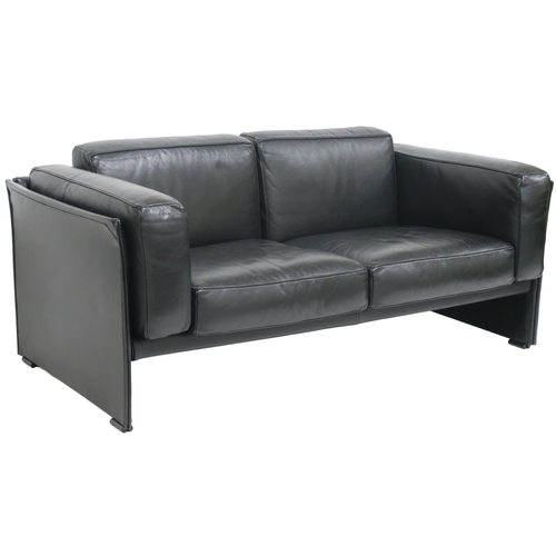 2085 - A 20TH CENTURY CASSINA TWO SEATER SETTEEwith black leather upholstered cushions on leather upholster... 