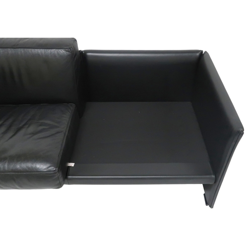 2085 - A 20TH CENTURY CASSINA TWO SEATER SETTEEwith black leather upholstered cushions on leather upholster... 