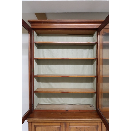 2032 - A VICTORIAN MAHOGANY LIBRARY BOOKCASE with moulded cornice over three glazed doors on base with... 