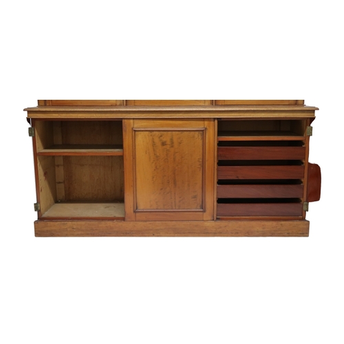 2032 - A VICTORIAN MAHOGANY LIBRARY BOOKCASE with moulded cornice over three glazed doors on base with... 