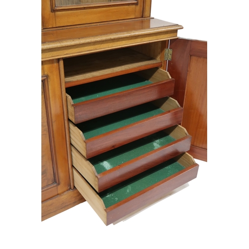 2032 - A VICTORIAN MAHOGANY LIBRARY BOOKCASE with moulded cornice over three glazed doors on base with... 