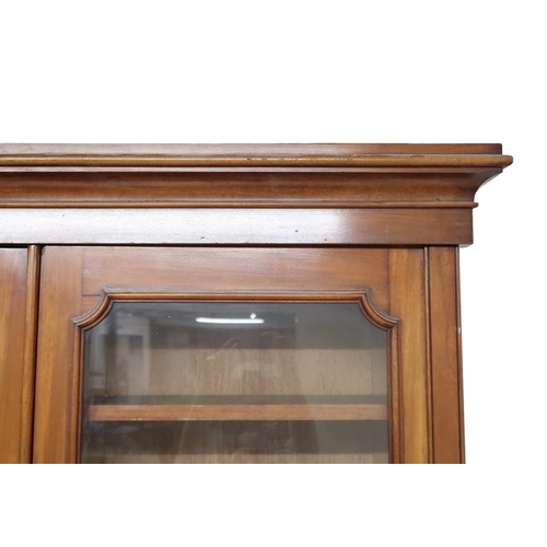 2032 - A VICTORIAN MAHOGANY LIBRARY BOOKCASE with moulded cornice over three glazed doors on base with... 