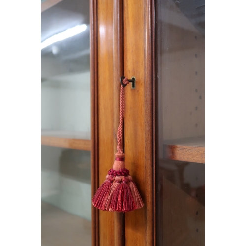 2032 - A VICTORIAN MAHOGANY LIBRARY BOOKCASE with moulded cornice over three glazed doors on base with... 