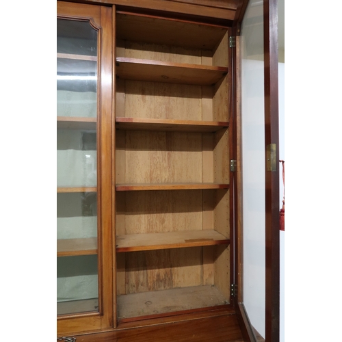 2032 - A VICTORIAN MAHOGANY LIBRARY BOOKCASE with moulded cornice over three glazed doors on base with... 