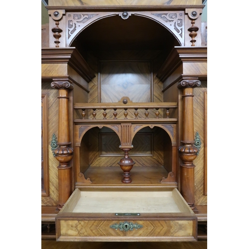 2033 - A 19TH CENTURY CONTINENTAL MAHOGANY AND WALNUT VENEERED SIDEBOARD stepped superstructure with m... 