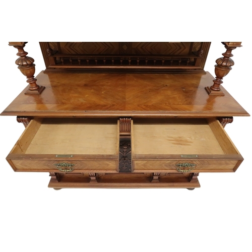 2033 - A 19TH CENTURY CONTINENTAL MAHOGANY AND WALNUT VENEERED SIDEBOARD stepped superstructure with m... 