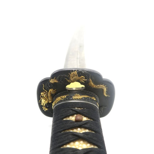 2609 - A FINE JAPANESE KATANAWith ornately cast bronze mounts throughout featuring gilt dragons; the white ... 