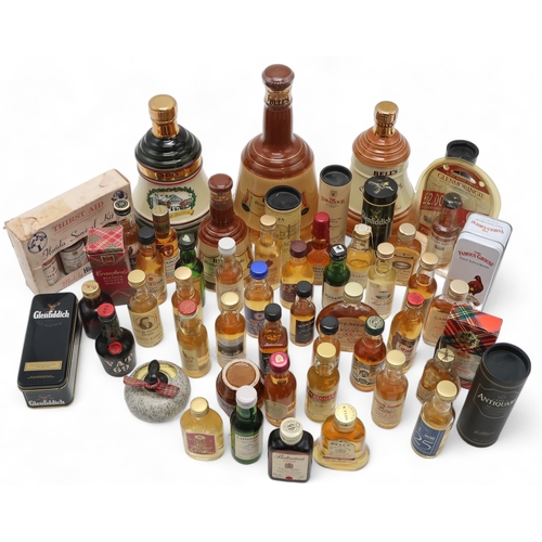 2695G - SCOTCH WHISKY Bell's Decanter Christmas 1990 together with whisky miniatures and empty whisky souven... 