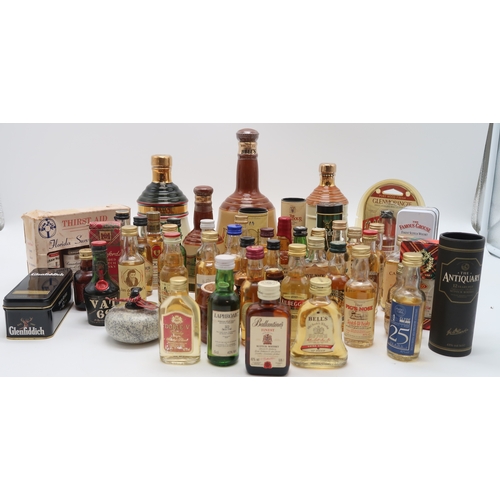 2695G - SCOTCH WHISKY Bell's Decanter Christmas 1990 together with whisky miniatures and empty whisky souven... 