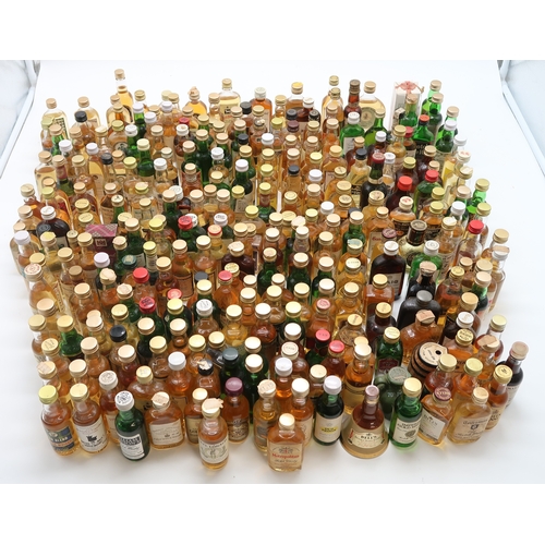 2698 - SCOTCH WHISKY A Collection Of Scotch Whisky Miniatures Together With A Bells Whisky Decanter And Liq... 