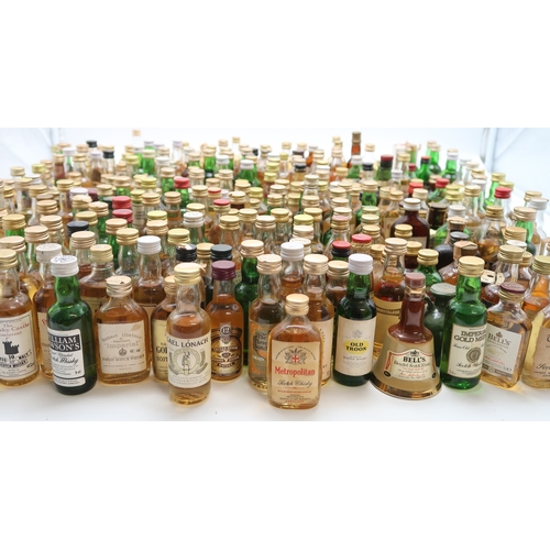 2698 - SCOTCH WHISKY A Collection Of Scotch Whisky Miniatures Together With A Bells Whisky Decanter And Liq... 