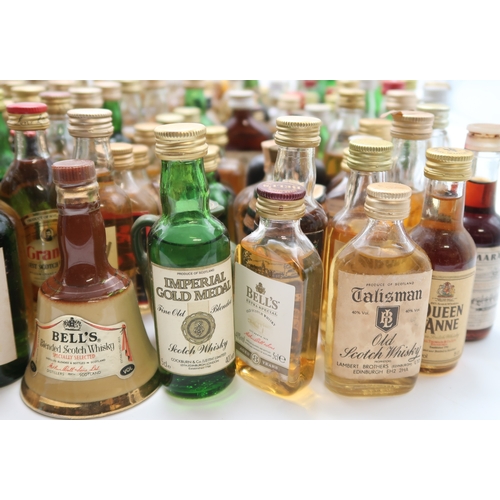 2698 - SCOTCH WHISKY A Collection Of Scotch Whisky Miniatures Together With A Bells Whisky Decanter And Liq... 