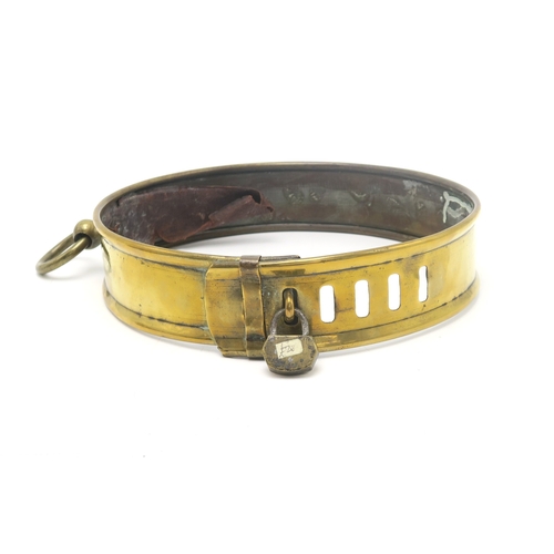 2668 - A LARGE 19th CENTURY BRASS DOG COLLARAdjustable in size, with padlock fastening, engraved 