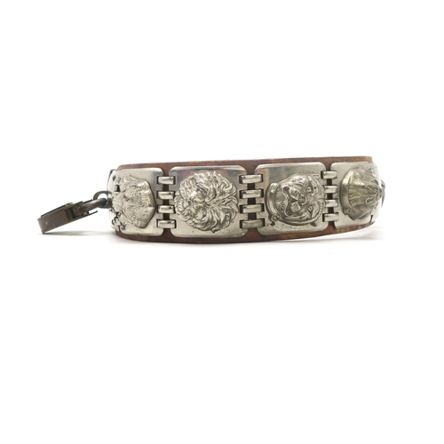 2667 - AN IMPRESSIVE WHITE METAL-MOUNTED LEATHER DOG COLLARCirca-1900, the linked metal plates each bearing... 