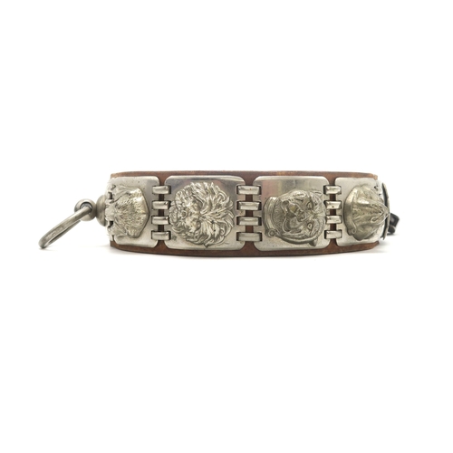 2667 - AN IMPRESSIVE WHITE METAL-MOUNTED LEATHER DOG COLLARCirca-1900, the linked metal plates each bearing... 