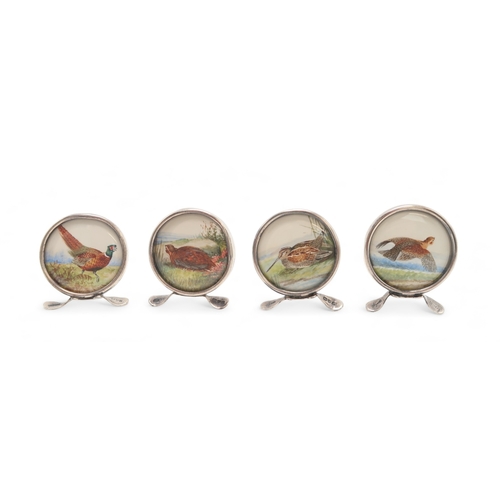 2529 - A SET OF FOUR EDWARDIAN SILVER 'GAME BIRD' MENU HOLDERSby Grey & Co, Chester 1913, each depictin... 