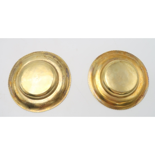 2534 - A PAIR OF GEORGE III IRISH SILVER GILT DISHESpossibly James Scott, Dublin 1810, of circular form, wi... 