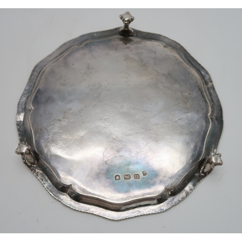 2536 - A GEORGE III SILVER WAITERby John Crouch I & Thomas Hannam, London 1775, of lobed form, with a g... 