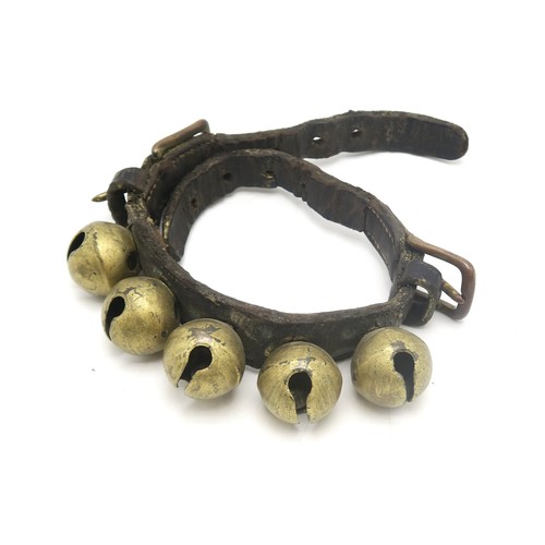 2668A - A 19th CENTURY BRASS DOG COLLARWith studded decoration, measuring approx. 12.5cm side-to-side and 13... 