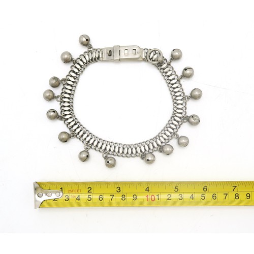 2669 - A WHITE METAL CHAIN-LINK DOG COLLARCirca-1900, suspending bells and size adjustable... 