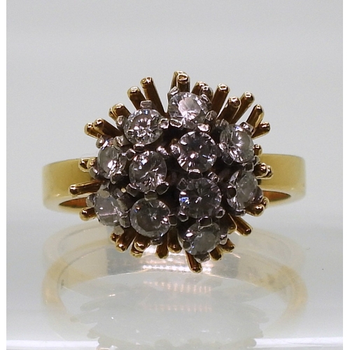 2822 - AN 18CT GOLD RETRO RINGset with a cluster of diamonds, with an estimated approximate combined total ... 