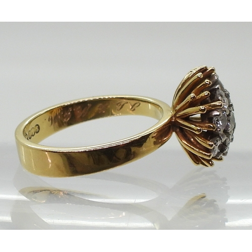 2822 - AN 18CT GOLD RETRO RINGset with a cluster of diamonds, with an estimated approximate combined total ... 