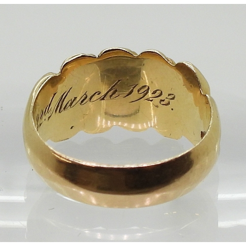 2827 - AN 18CT GOLD MOURNING RINGthe band decorated with flowers, hallmarked Birmingham 1919, with inscript... 