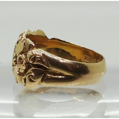 2827 - AN 18CT GOLD MOURNING RINGthe band decorated with flowers, hallmarked Birmingham 1919, with inscript... 