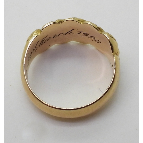 2827 - AN 18CT GOLD MOURNING RINGthe band decorated with flowers, hallmarked Birmingham 1919, with inscript... 