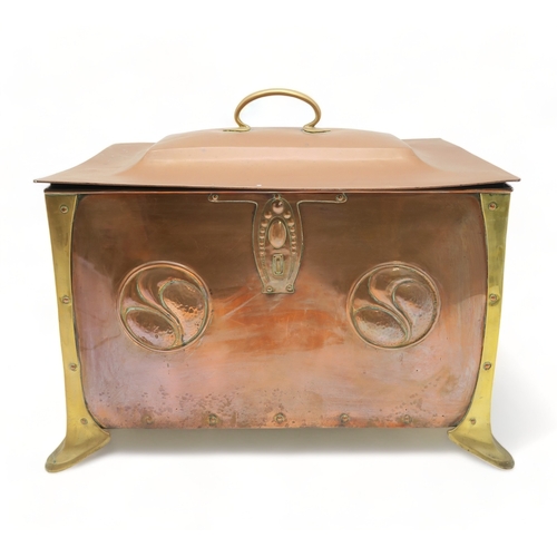 2317 - AN ARTS AND CRAFTS COPPER AND BRASS COAL BINof rectangular form with heart terminal handles to eithe... 