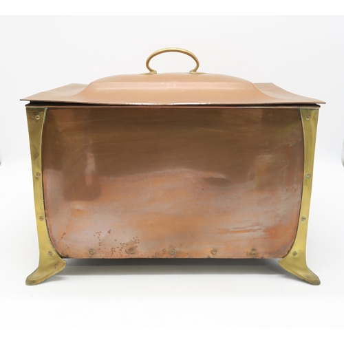 2317 - AN ARTS AND CRAFTS COPPER AND BRASS COAL BINof rectangular form with heart terminal handles to eithe... 