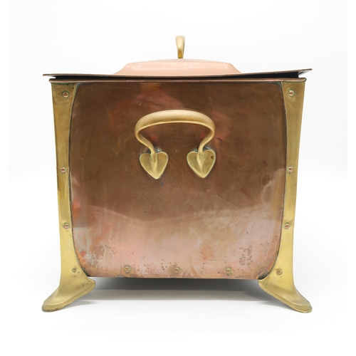 2317 - AN ARTS AND CRAFTS COPPER AND BRASS COAL BINof rectangular form with heart terminal handles to eithe... 