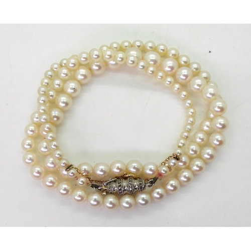 2797 - PEARLS WITH A DIAMOND CLASPthe white pearls have a pink lustre, and taper from 6.4mm to 2.9mm, with ... 