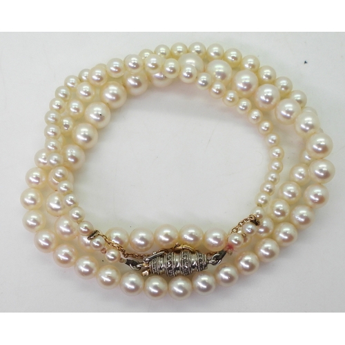 2797 - PEARLS WITH A DIAMOND CLASPthe white pearls have a pink lustre, and taper from 6.4mm to 2.9mm, with ... 