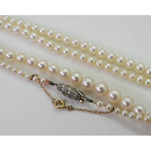 2797 - PEARLS WITH A DIAMOND CLASPthe white pearls have a pink lustre, and taper from 6.4mm to 2.9mm, with ... 