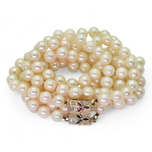 2829 - PEARLS WITH A METAMORPHIC CLASPthe double string of pearls has a ruby sapphire and diamond 14k gold ... 