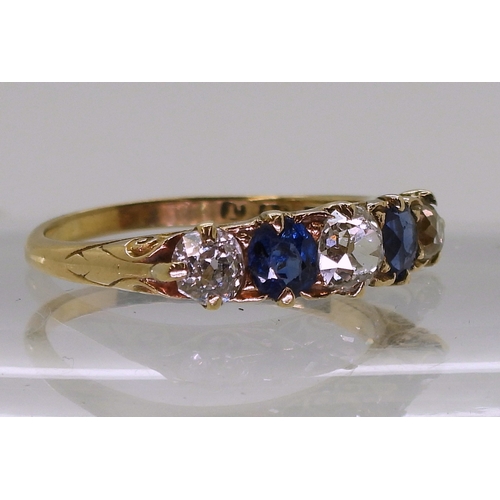 2832 - A FIVE STONE RINGset with two oval cut sapphires and three old cut diamonds with an estimated approx... 