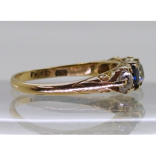 2832 - A FIVE STONE RINGset with two oval cut sapphires and three old cut diamonds with an estimated approx... 