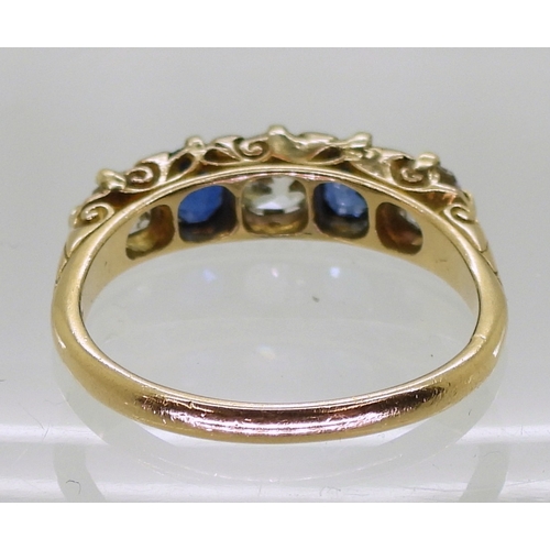 2832 - A FIVE STONE RINGset with two oval cut sapphires and three old cut diamonds with an estimated approx... 