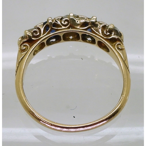 2832 - A FIVE STONE RINGset with two oval cut sapphires and three old cut diamonds with an estimated approx... 