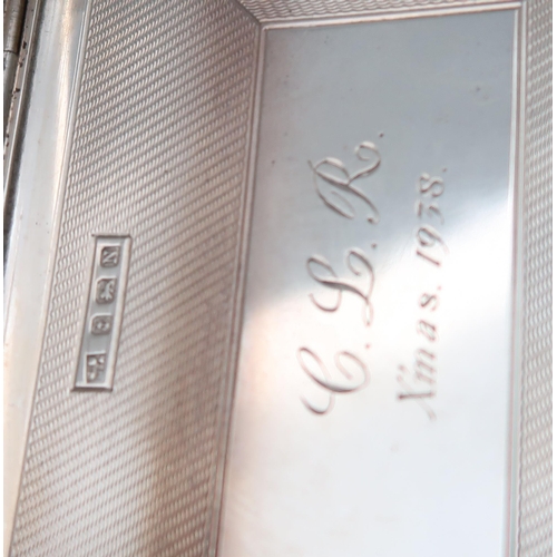 265 - A silver cigarette case by Francis Howard Ltd, and two others, Birmingham marks, all with engine-tur... 