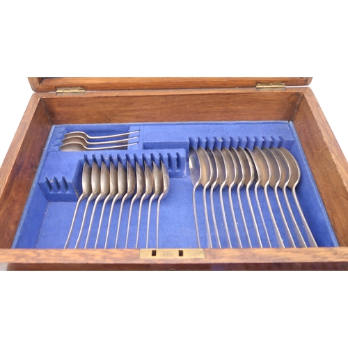 295 - A cased three layer canteen of stainless steel ivorine / whalebone handled cutlery, 67 pieces