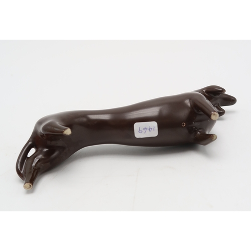 2286 - COLIN MELBOURNE FOR BESWICK  A 1950's figure of a Dachshund, in dark brown glaze, model 1469, stylis... 