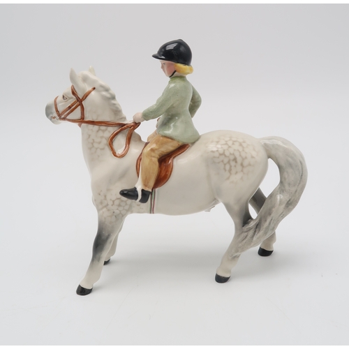 2292 - BESWICK GIRL ON LIGHT DAPPLE GREY PONYwearing a green jacket, model 1499