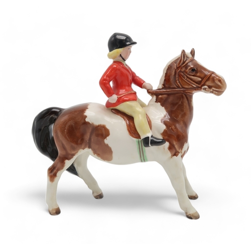 2293 - BESWICK GIRL ON SKEWBALD PONYwearing a red jacket, model 1499