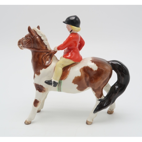 2293 - BESWICK GIRL ON SKEWBALD PONYwearing a red jacket, model 1499