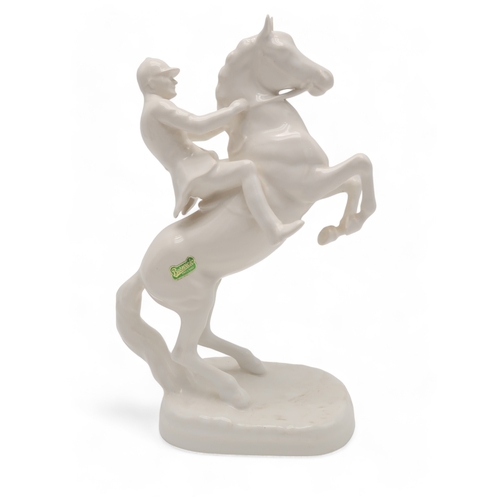 2294 - A BESWICK WHITE GLOSS HUNTSMAN ON REARING HORSEmodel 868, printed and impressed marks to base and gr... 