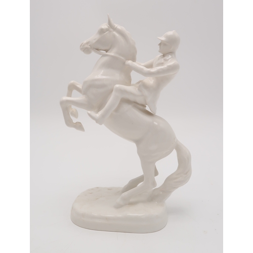 2294 - A BESWICK WHITE GLOSS HUNTSMAN ON REARING HORSEmodel 868, printed and impressed marks to base and gr... 