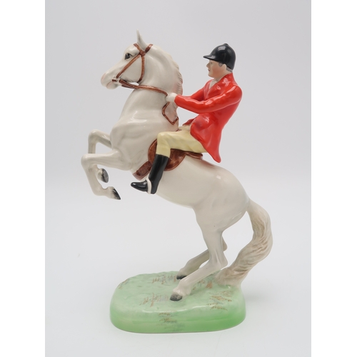 2296 - A BESWICK HUNTSMAN ON WHITE REARING HORSEmodel 868, printed and impressed marks to base... 