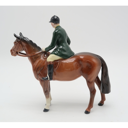 2299 - BESWICK HUNTSMAN ON HORSEmodel 1501 with green jacket, printed mark to underside... 